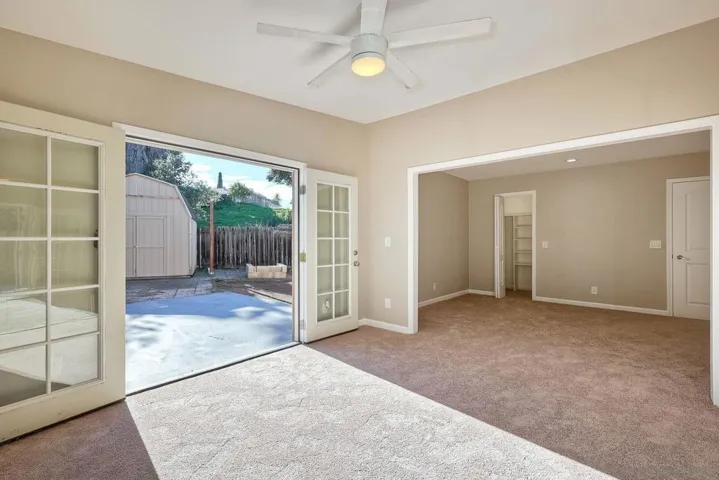 PRIMARY BEDROOM WITH ACCESS TOWARDS BACKYARD!