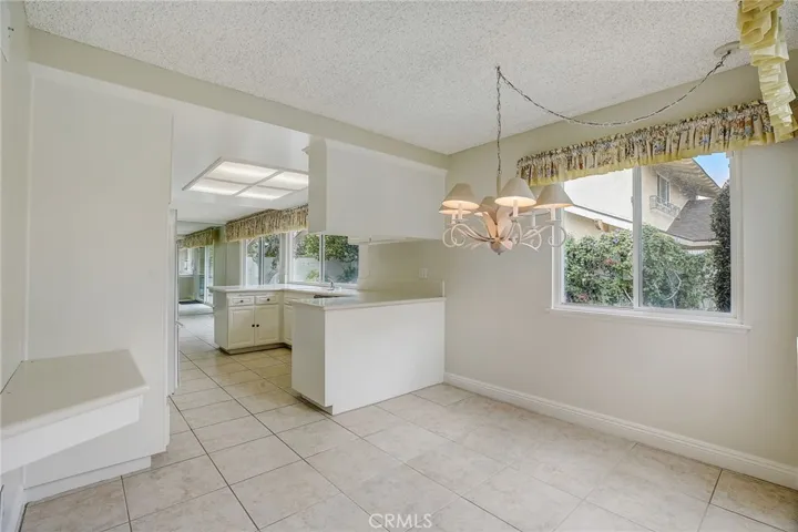 Kitchen eating area with corner desk