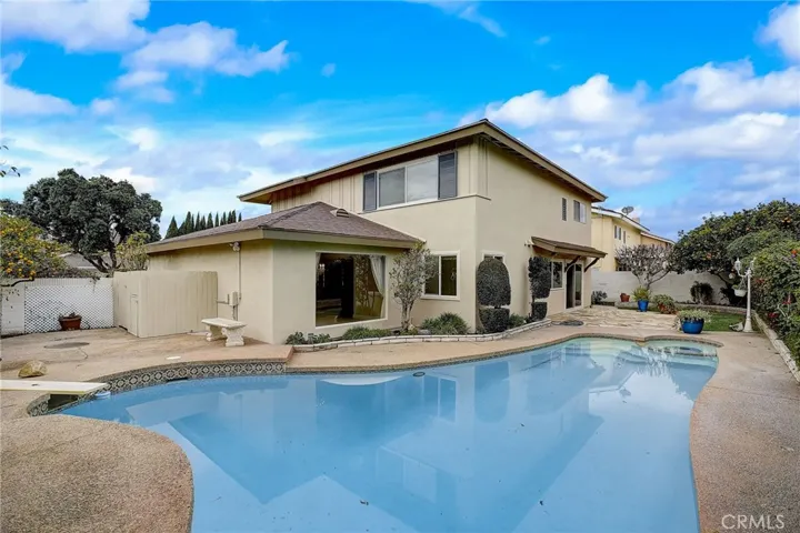 Pool with stone walkway and sundeck