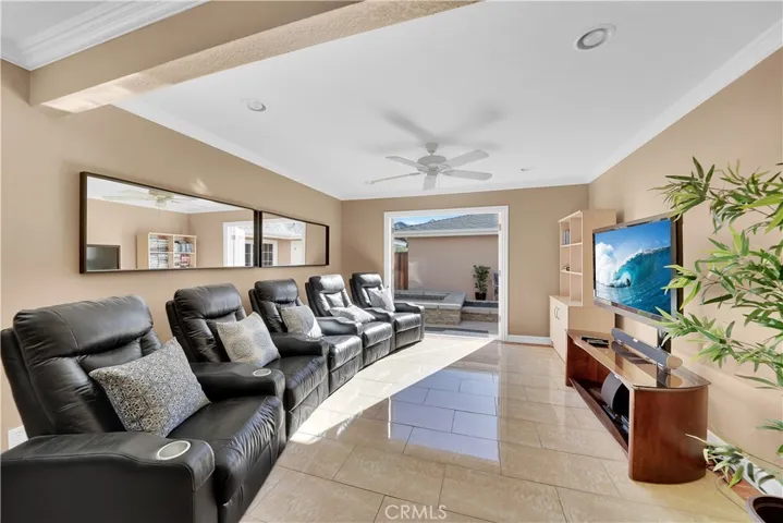 This is the Living Room in the Downstairs Unit or if you don't close off the Downstairs Unit from the Main House, this Becomes your Family Room or Theater Room. It has French Doors Opening to the Atrium Courtyard and is Open to a Full-Size Dining Room