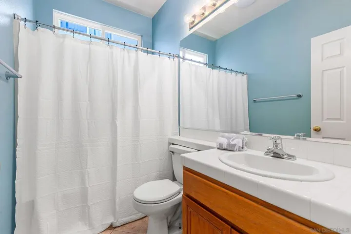 Bathroom next to bedroom at front of house