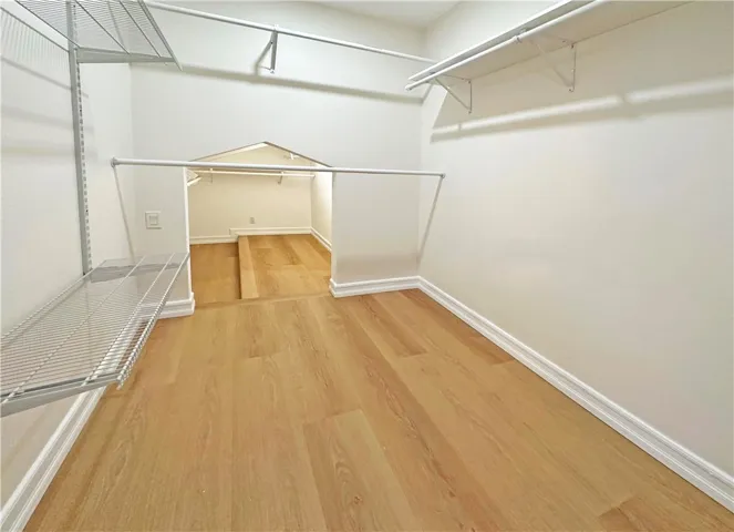Primary Suite Walk-In Closet with Added Attic Storage