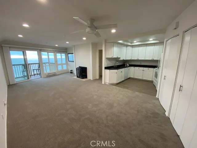 Living room, dining area and kitchen