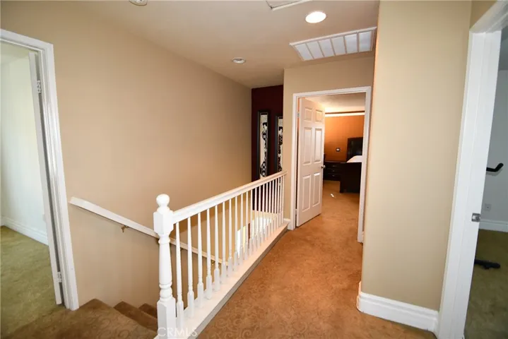 Stairway to all 3 bedrooms