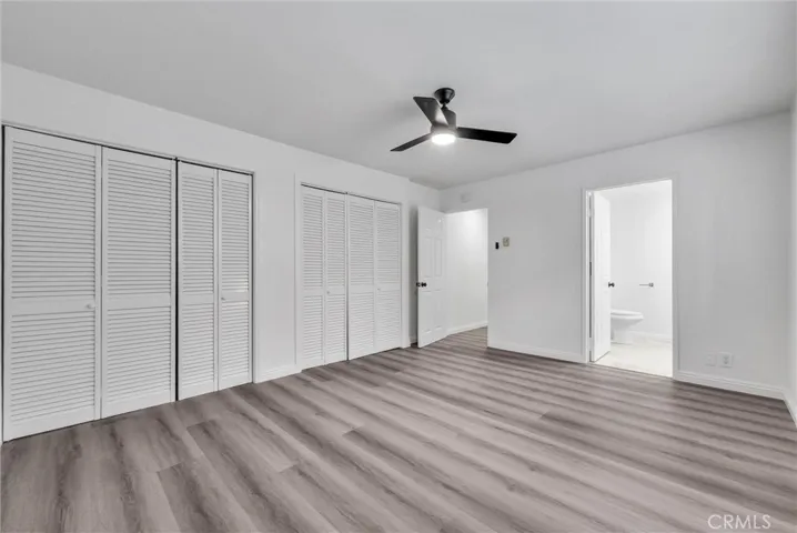 Southwest view of master room w/ closet space and entrance to newly remodeled master bathroom.