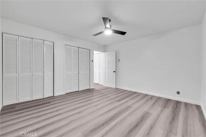 Northwest view of guest bedroom , closet and entrance door to this room.