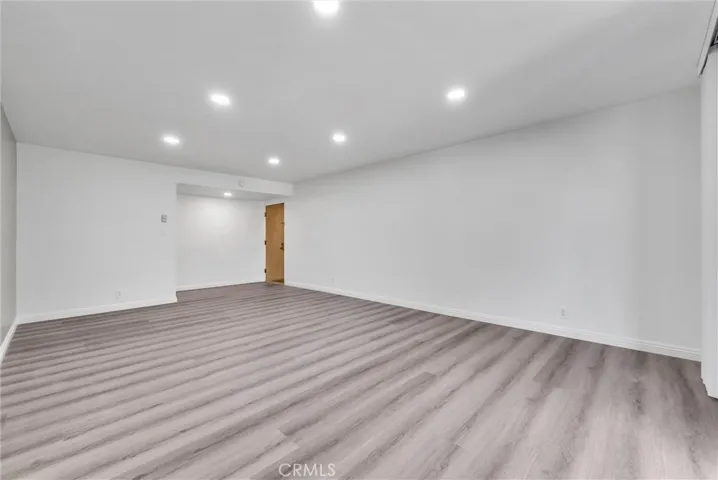 East View of living room toward entrance door to condo.