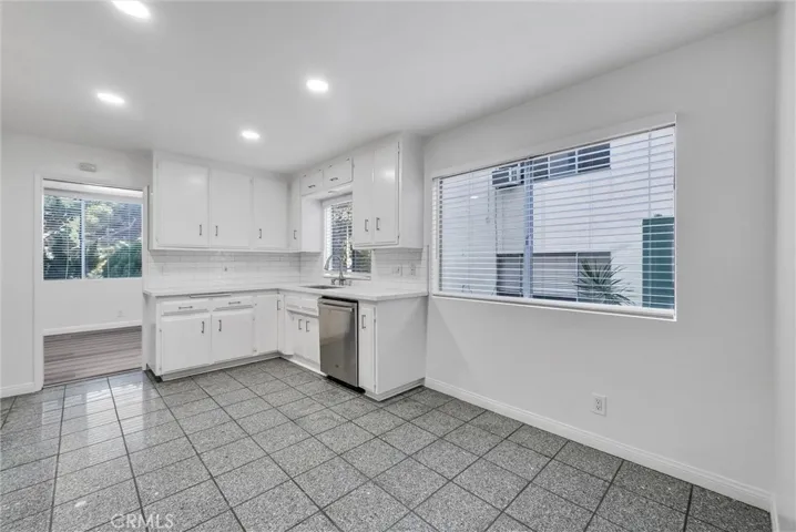 North west view of kitchen with ceramic tile flooring