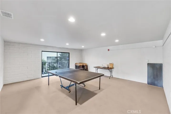 Rec room with pig pong table and HOA meeting room.