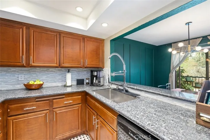 Beautiful kitchen with spacious granite counter tops and large sink