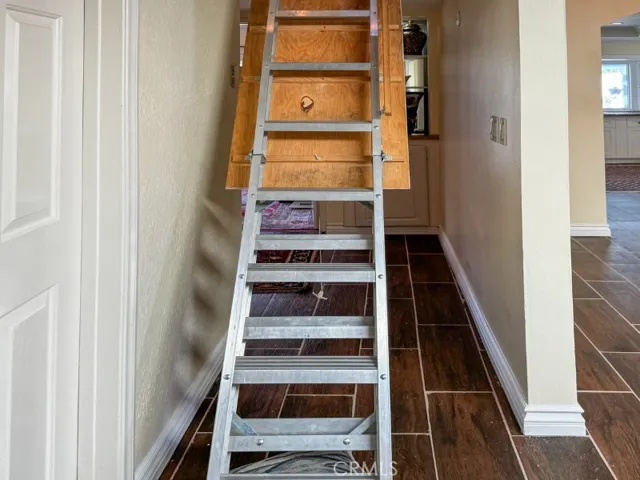 Pull ladder to the the attic/potential office.