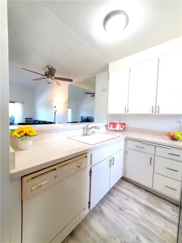 Kitchen has breakfast bar looking into the dining area and living room.