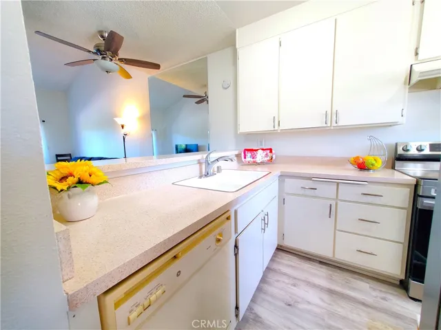 Kitchen has breakfast bar looking into the dining area and living room.