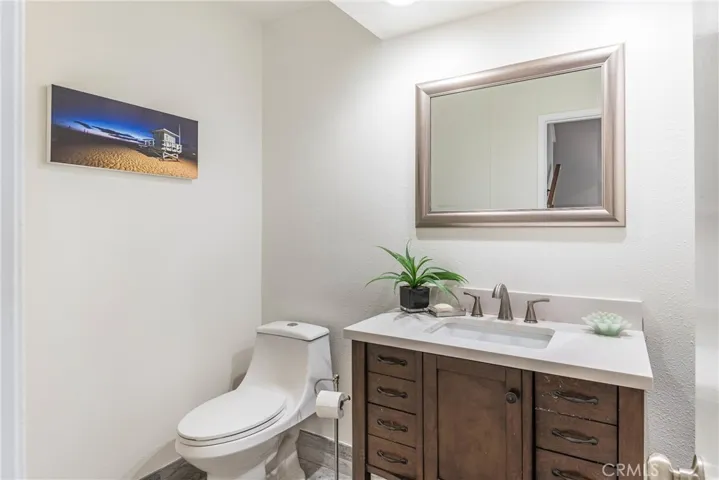 Updated powder room downstairs, new paint, newer vanity, new mirror and more.