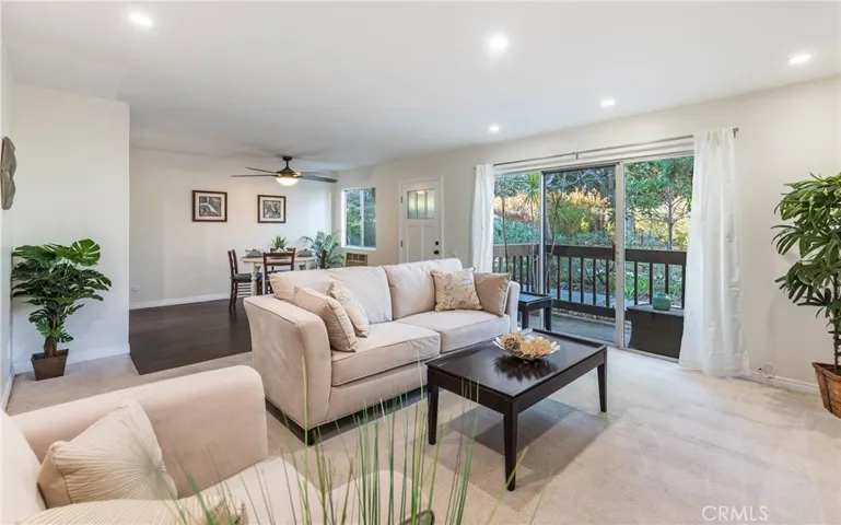 Large sliders to the private patio to enjoy the park like grounds of Miraleste Canyon
