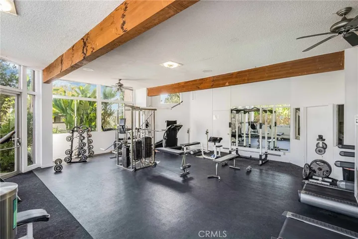 Fitness center with free weights, machines and more.....who needs to pay for a gym when you have this?