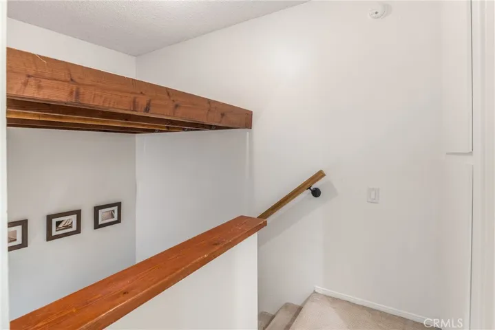 Storage loft added above the stairs.