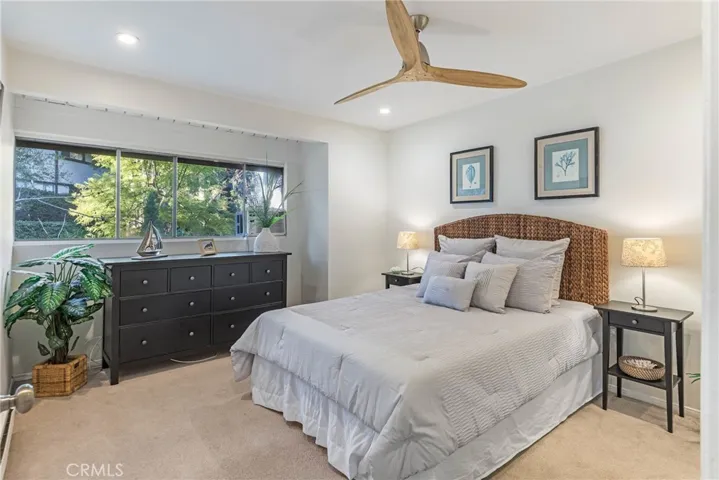 One of two 2nd floor bedrooms.  Features included recessed lights, ceiling fan, new paint, large windows, huge closet and wall mounted A/C