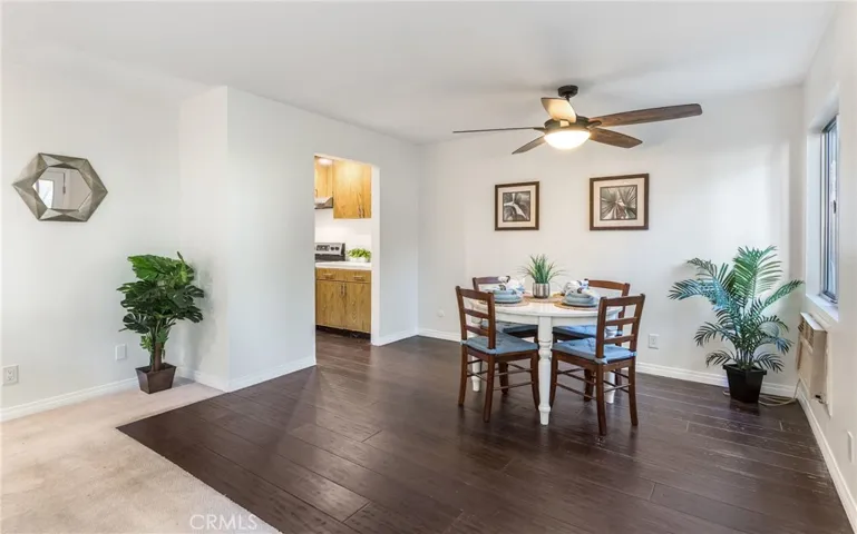 Huge dining area with rich, dark hardwood floors