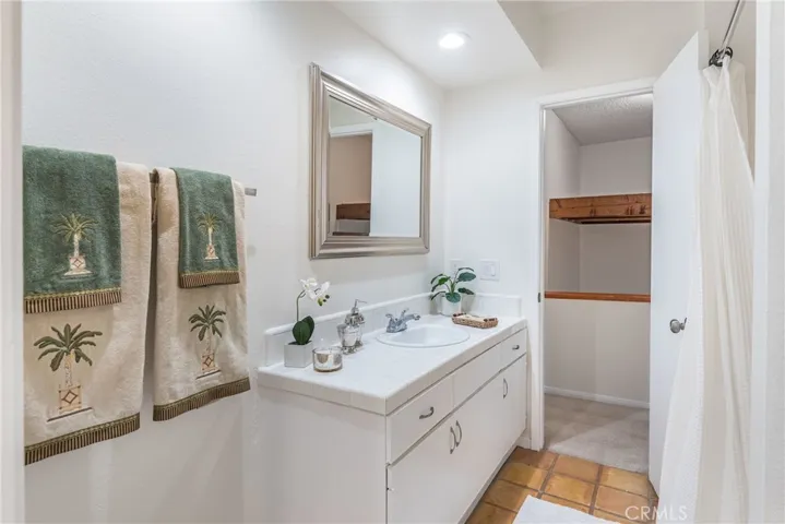 Upstairs bathroom featuring separate tub and shower, separate vanity areas, new paint, new mirrors and lighting, saltillo tile and more.
