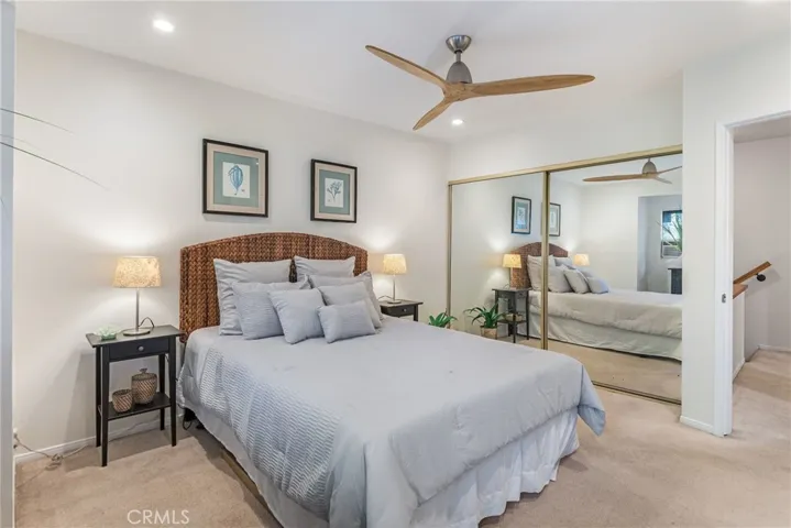 Beauiful and spacious 2nd bedroom with large closet, recessed lights, hip and functional brushed nickel and wood ceiling fan and new paint.