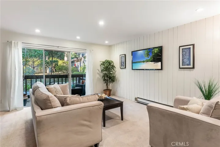 Bright and beautiful with large sliders to catch the sunshine and breezes. **TV is staged TV