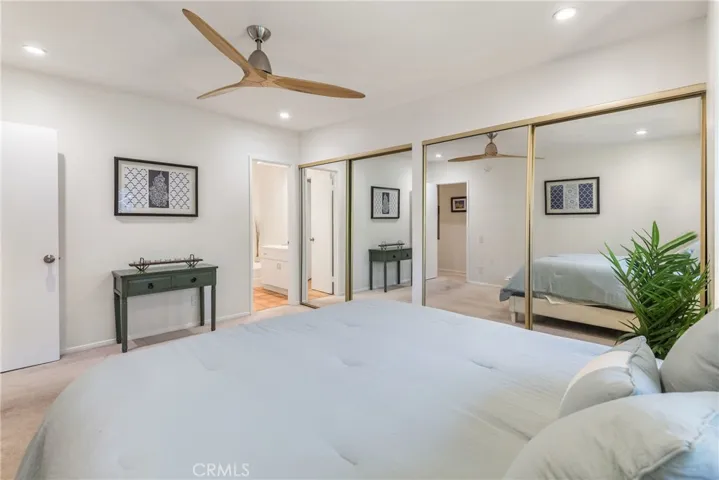 Larger of the 2 spacious bedrooms featuring 2 huge closets, recessed lights, contemporary ceiling fan, new paint and more.