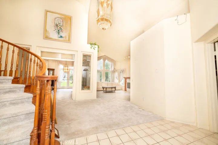 Entry way opening to the formal living room and formal dining room