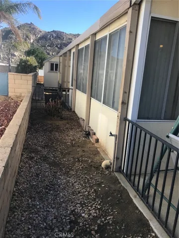SIDE BY ENCLOSED PATIO TOWARD BACK