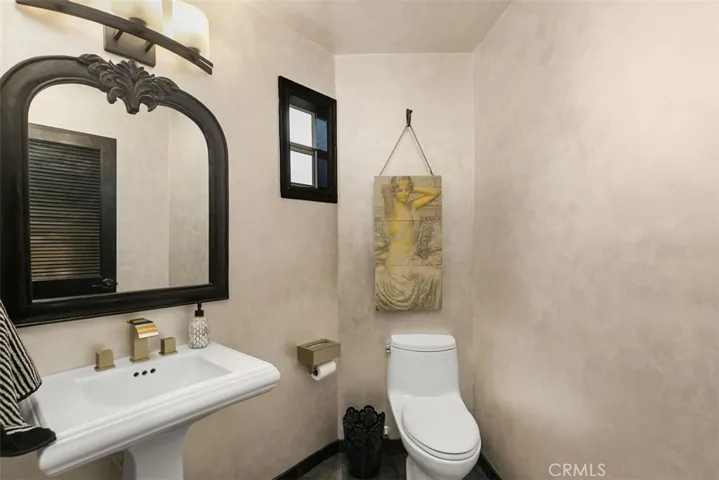 Downstairs powder room is so very cool and artsy.