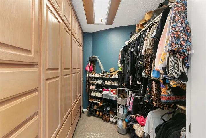Primary bedroom has this fabulous walk in closet with cabinets and a second extra large closet.