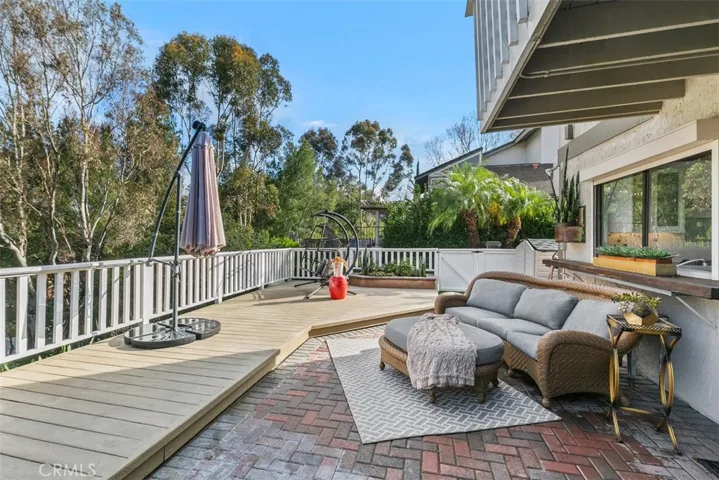 Backyard deck and entertainment area. Side gate leads back out to the front yard and street.