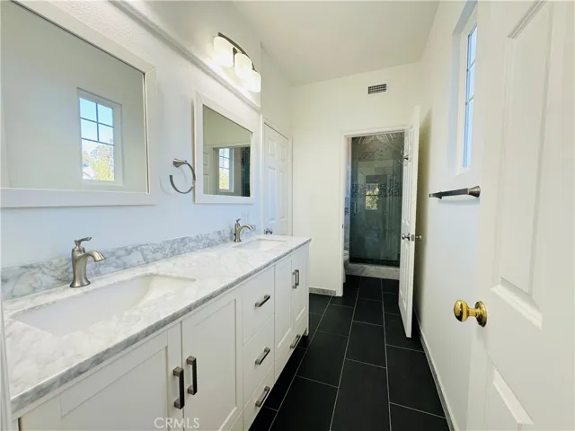 Upstairs bathroom updated with dual sinks and showe
