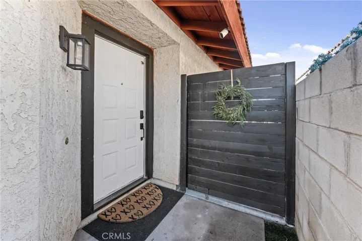 Front door located on the side of the home.