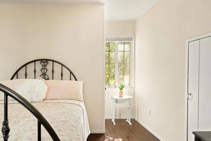 Enchanting upstairs 2nd bedroom with large closet, gas fireplace and custom door