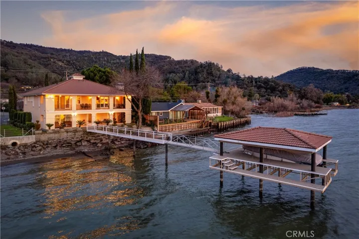 Custom mediterranean home with boat lift and dock