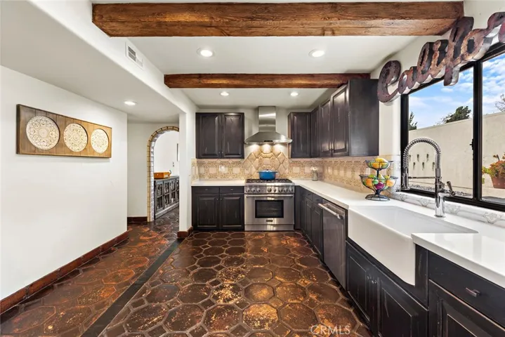 Kitchen with quartz counters and stainless steel appliances