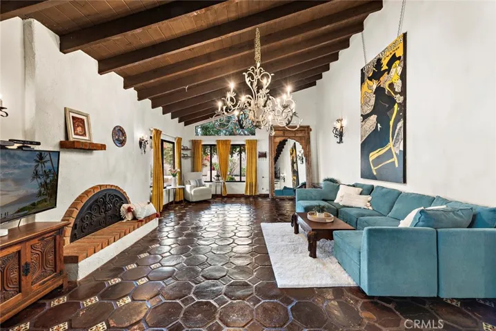 Spacious living room with dramatic beam ceilings