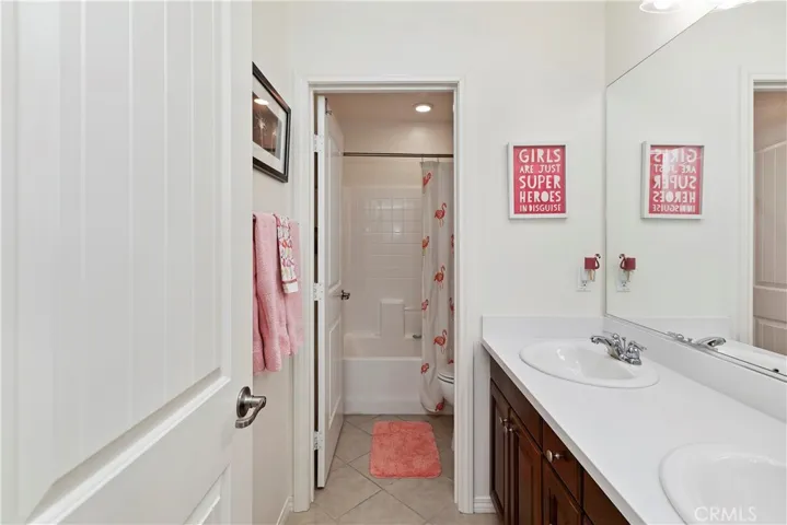 Upstairs Hall Bathroom with Separate Tub/shower Room and Dual Sinks.
