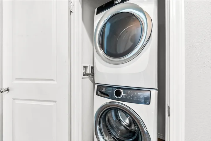 Stackable washer and dryer included.