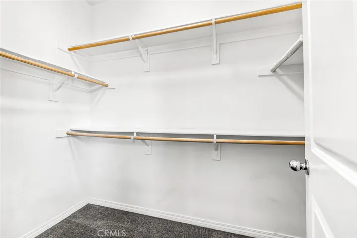 Walk-in closet at primary bedroom