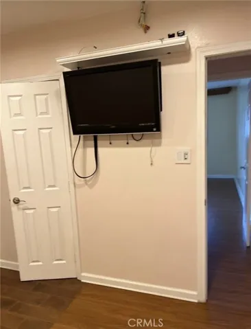Primary Bedroom with wall mount TV direct access to backyard