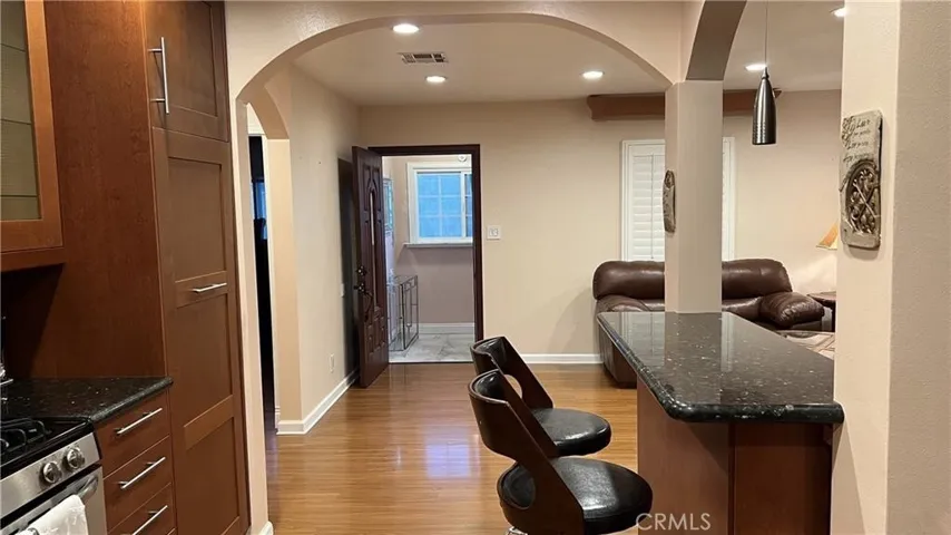 View to front door and living room from kitchen