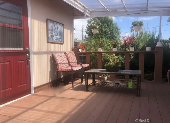Deck patio with access to primary bedroom