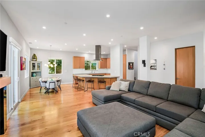 Formal dining, breakfast bar, kitchen and living room all in one space.