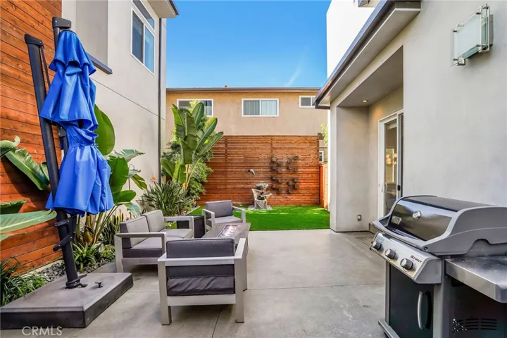 Large backyard with turf and fountain
