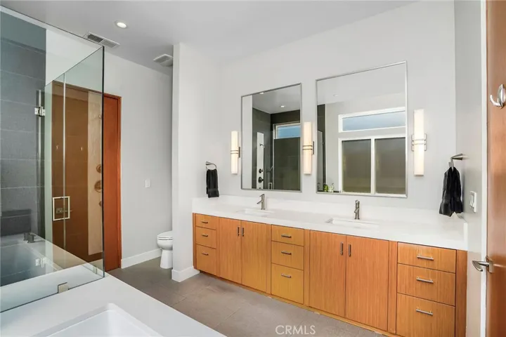 Primary bathroom with dual sinks.
