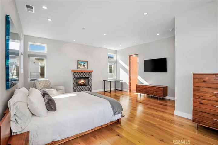 Large primary suite with  room for a seating area.