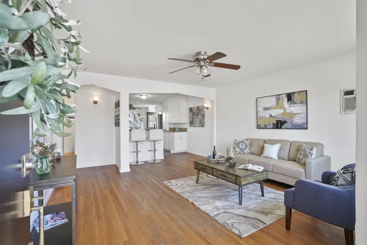 Come on in! New paint inside & out, hardwood flooring and large living spaces.