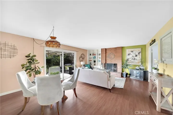 Relax in a separate family room with an additional fireplace, built-in bookshelves, and sliders leading to the backyard.
